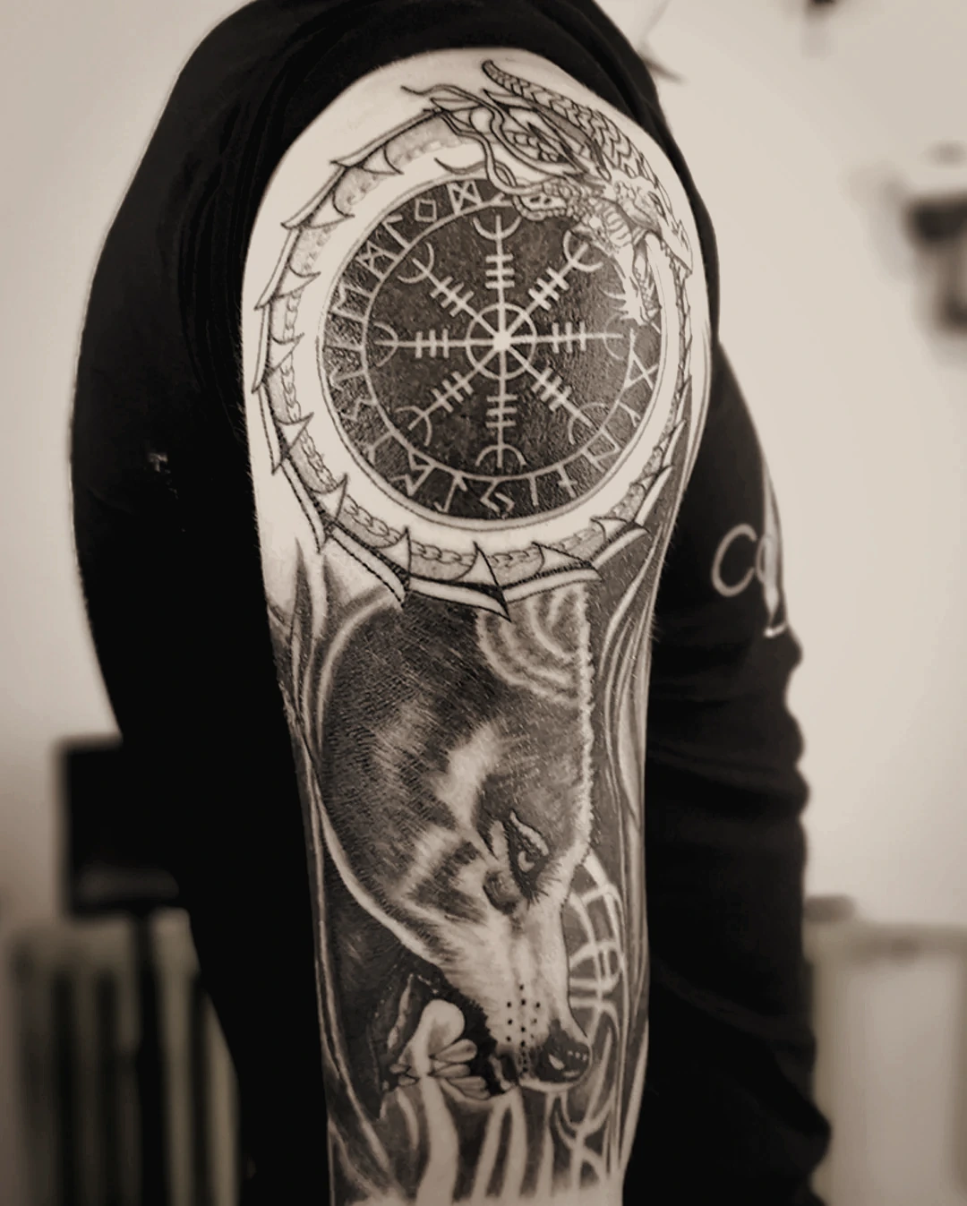 Wolf compass tattoo Osijek — Seifert Tattoo